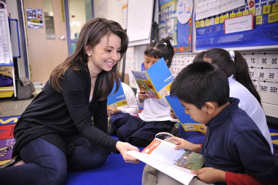 Teacher on the floor with students